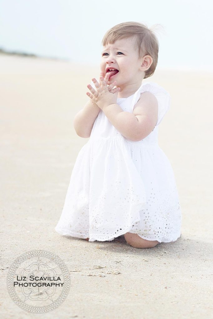 Baby Playing In The Sand