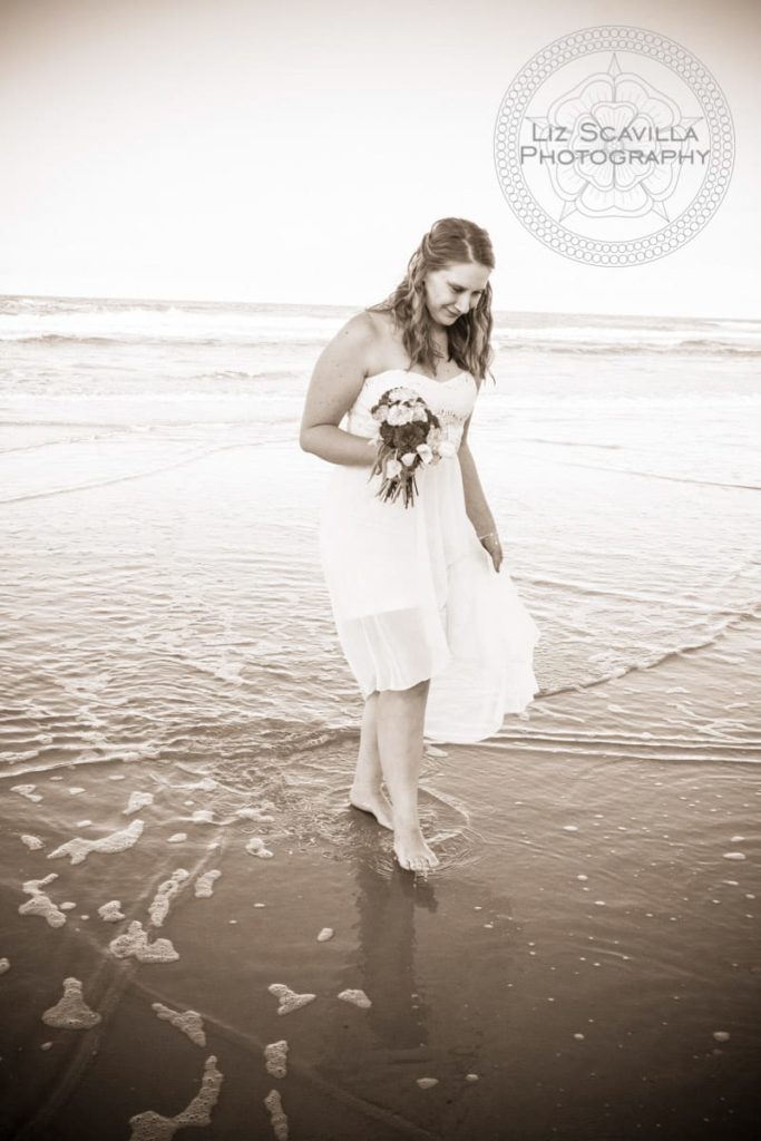 Bride walking along beach