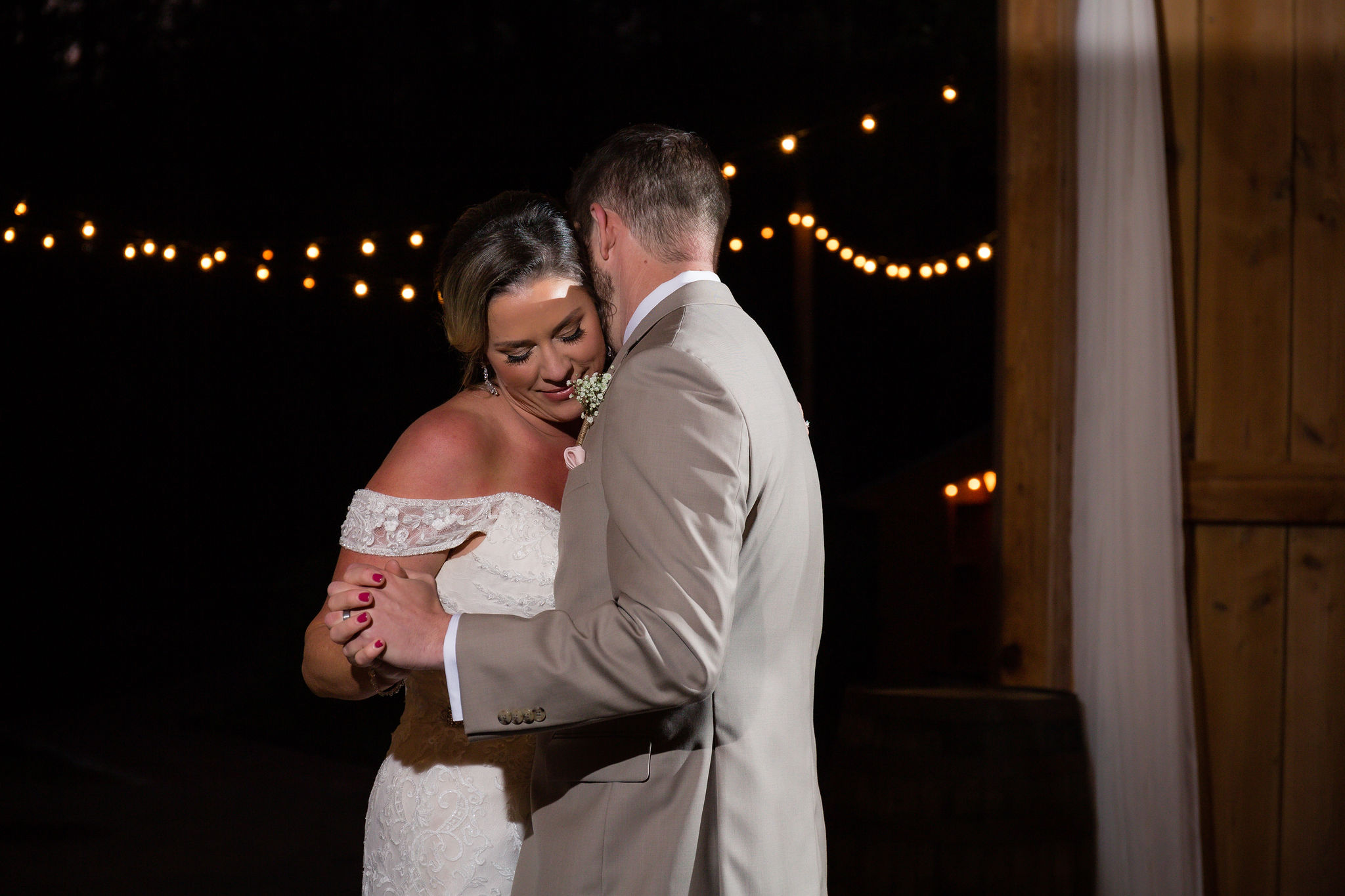 A sweet moment captured during their first dance. 