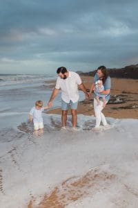 children playing in sand beach photo