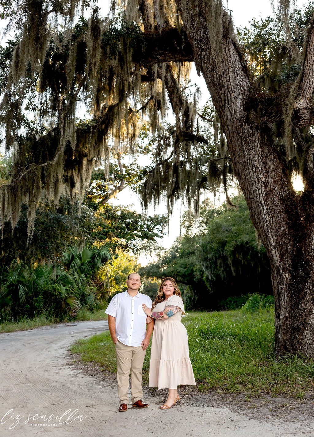 Amber and Nathan’s The Loop engagement photos beneath a moss-covered oak in Ormond Beach